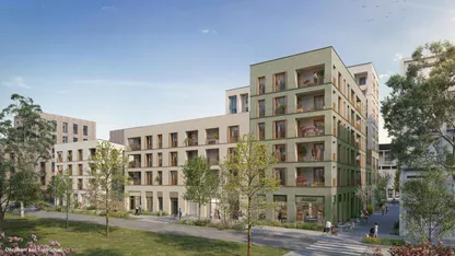 Résidence neuve JAVA sur l’île de Nantes : façades vert sauge et beige, balcons fleuris, rue arborée